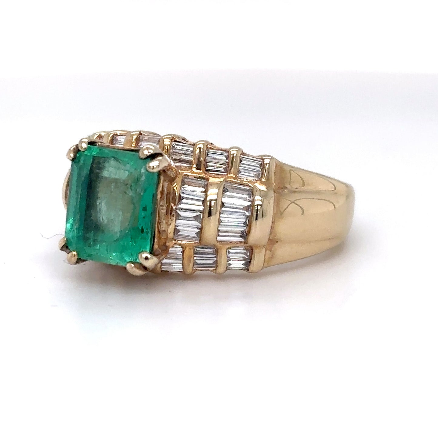 14KY 3.95CTW EMERALD-BAGUETTE DIAMOND RING