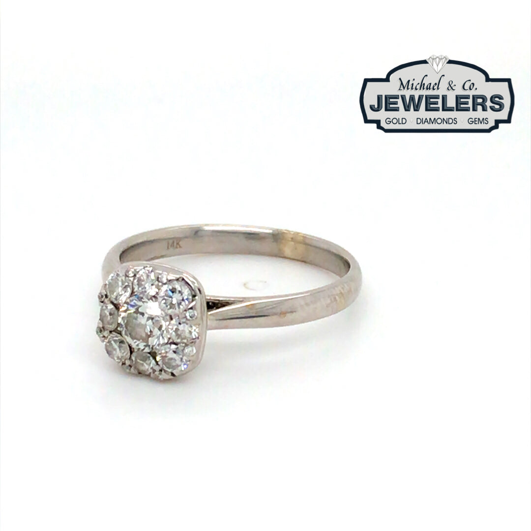 Diamond ring with 'Michael & Co. Jewelers' logo in the corner