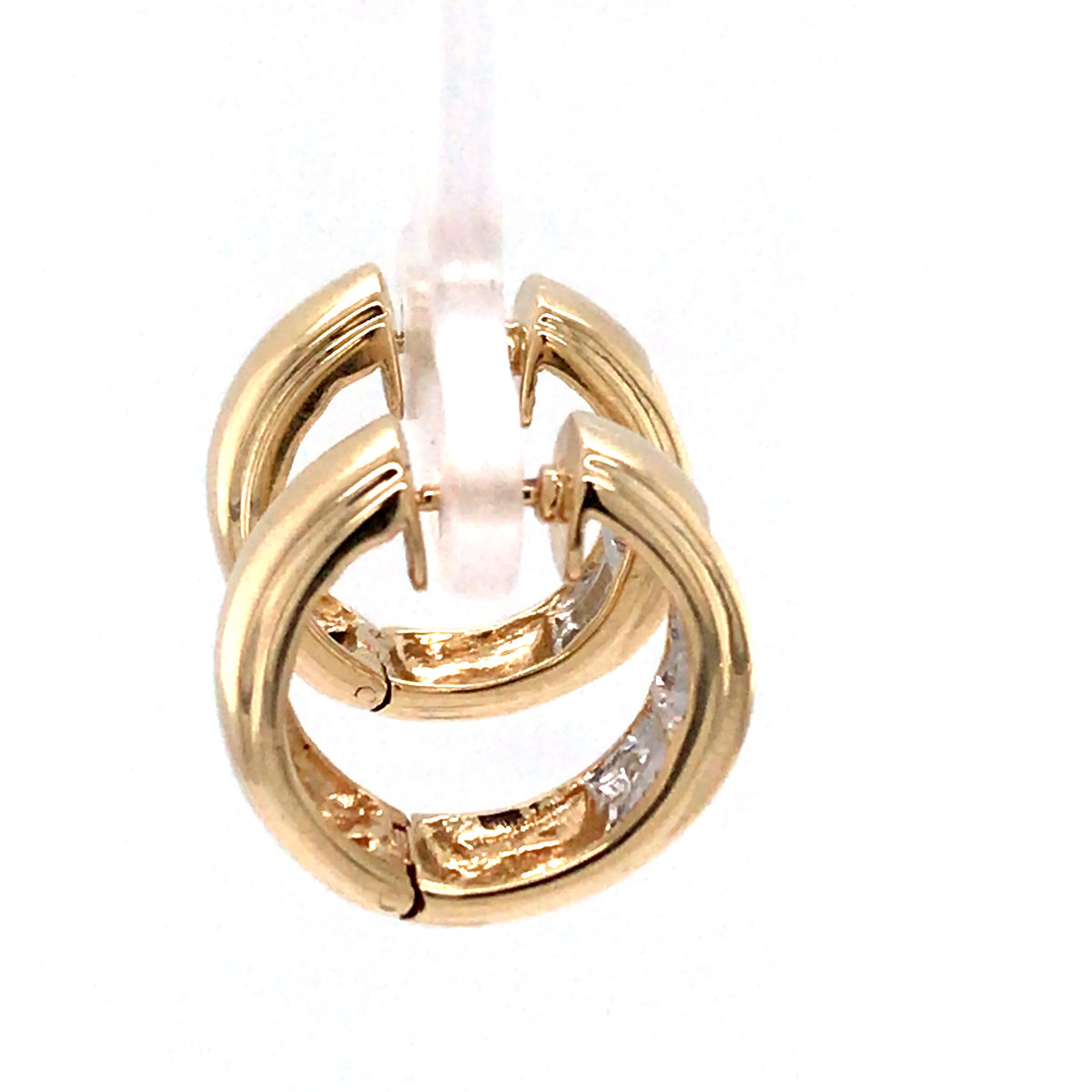 Gold ring with interlocking design on a white background