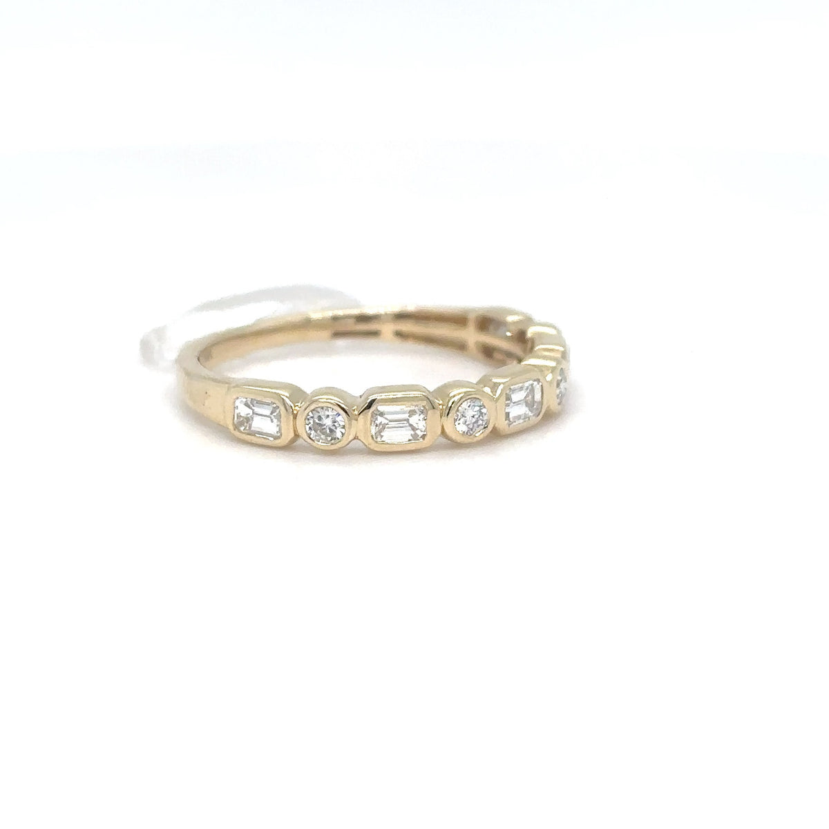 A 14K yellow gold band with alternating bezel-set emerald-cut and round brilliant diamonds, shown on a white background.