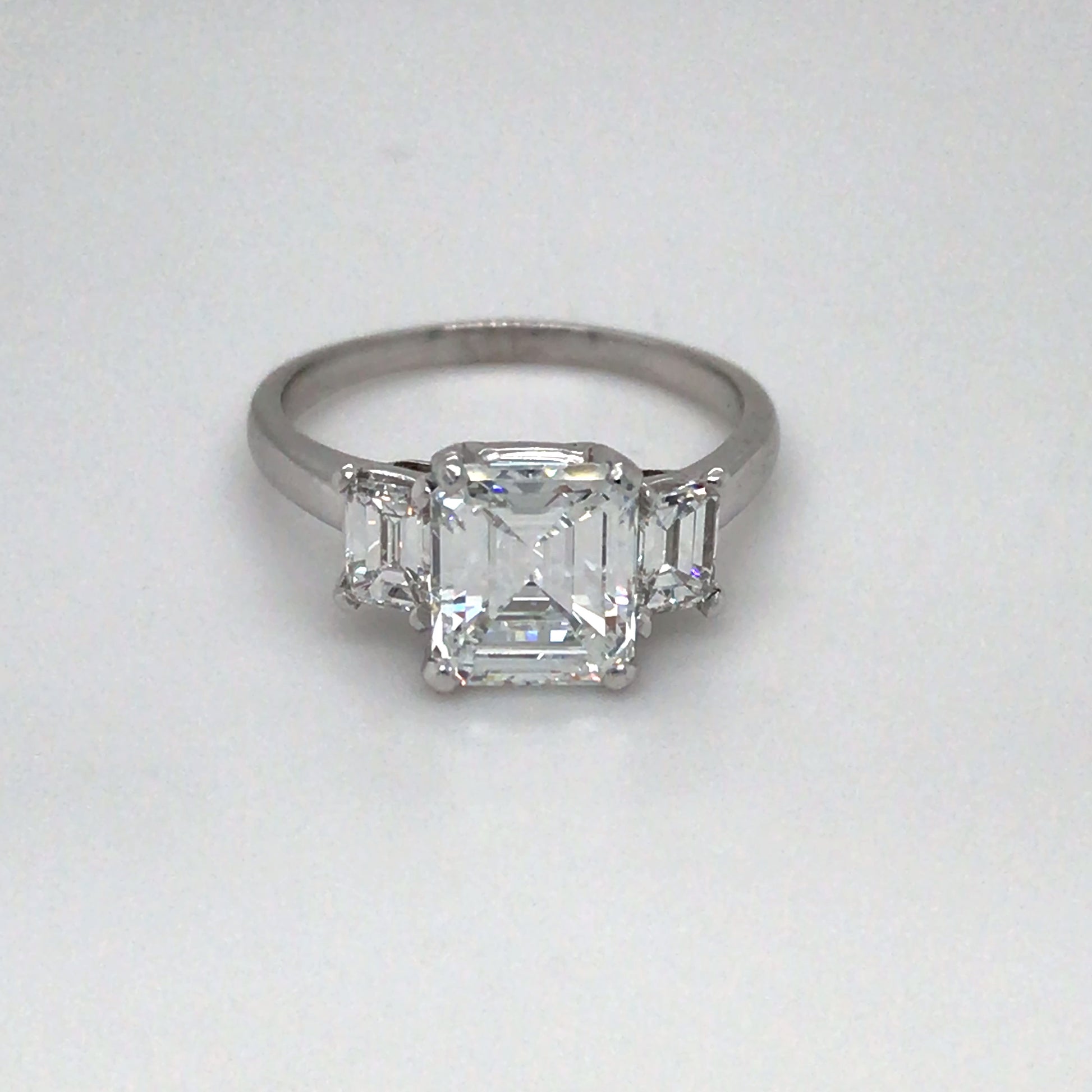 PLAT 2.67CTW EMERALD CUT THREE STONE DIAMOND ENGAGEMENT RING