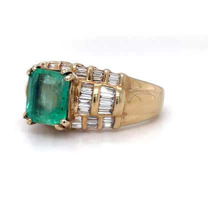 14KY 3.95CTW EMERALD-BAGUETTE DIAMOND RING
