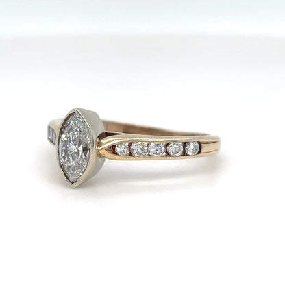Diamond ring with a hexagonal center stone on a white background