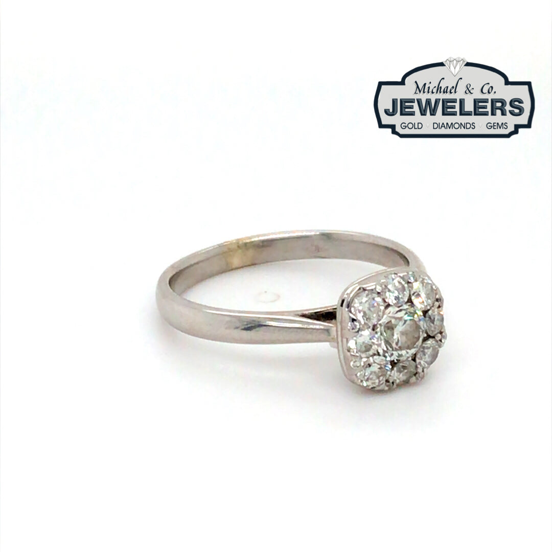 Diamond ring with 'Michael & Co. Jewelers' logo in the corner