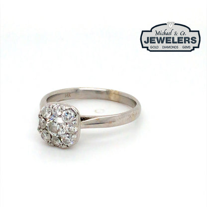Diamond ring with 'Michael & Co. Jewelers' logo in the corner