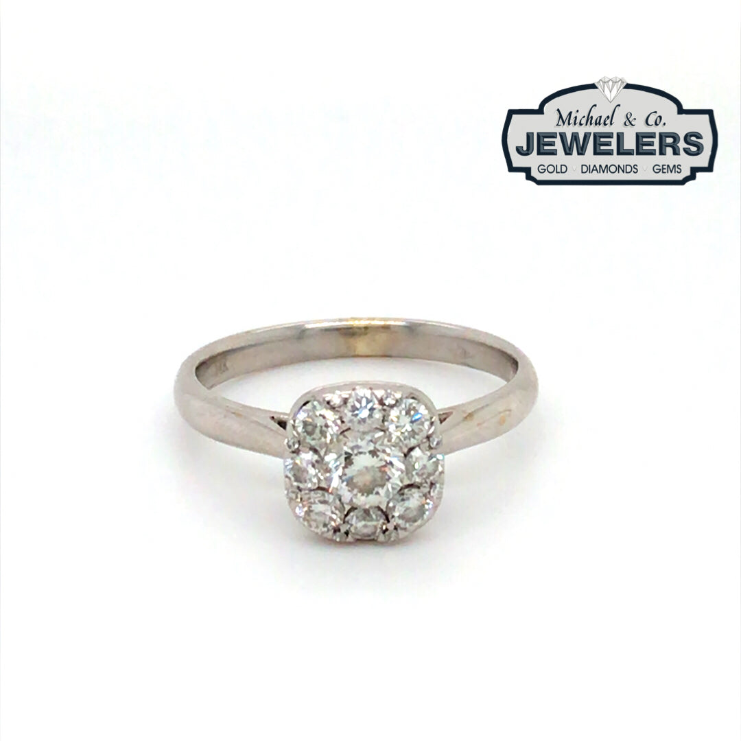 Diamond ring with 'Michael & Co. Jewelers' logo in the corner