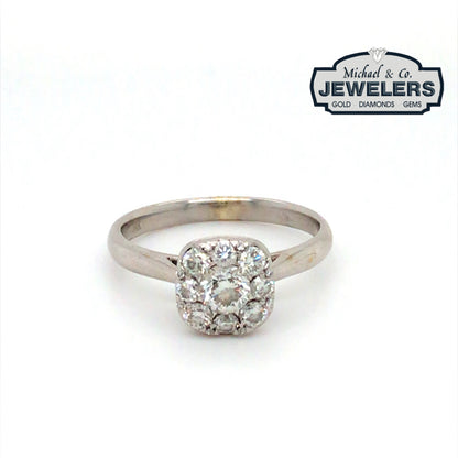 Diamond ring with 'Michael & Co. Jewelers' logo in the corner