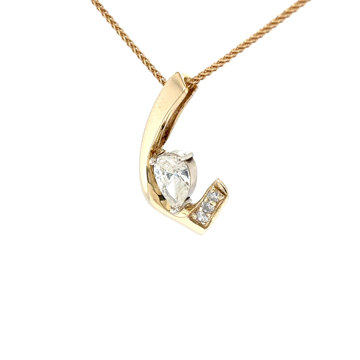 Gold pendant with a pear-shaped diamond on a white background