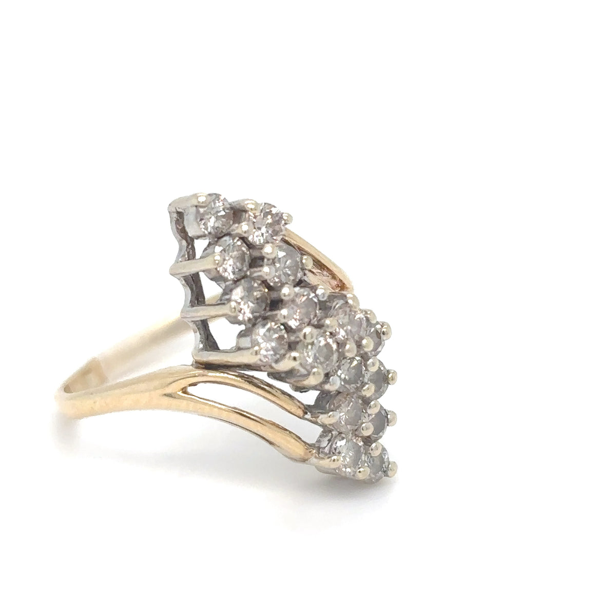 Gold and silver ring with diamond cluster on a white background
