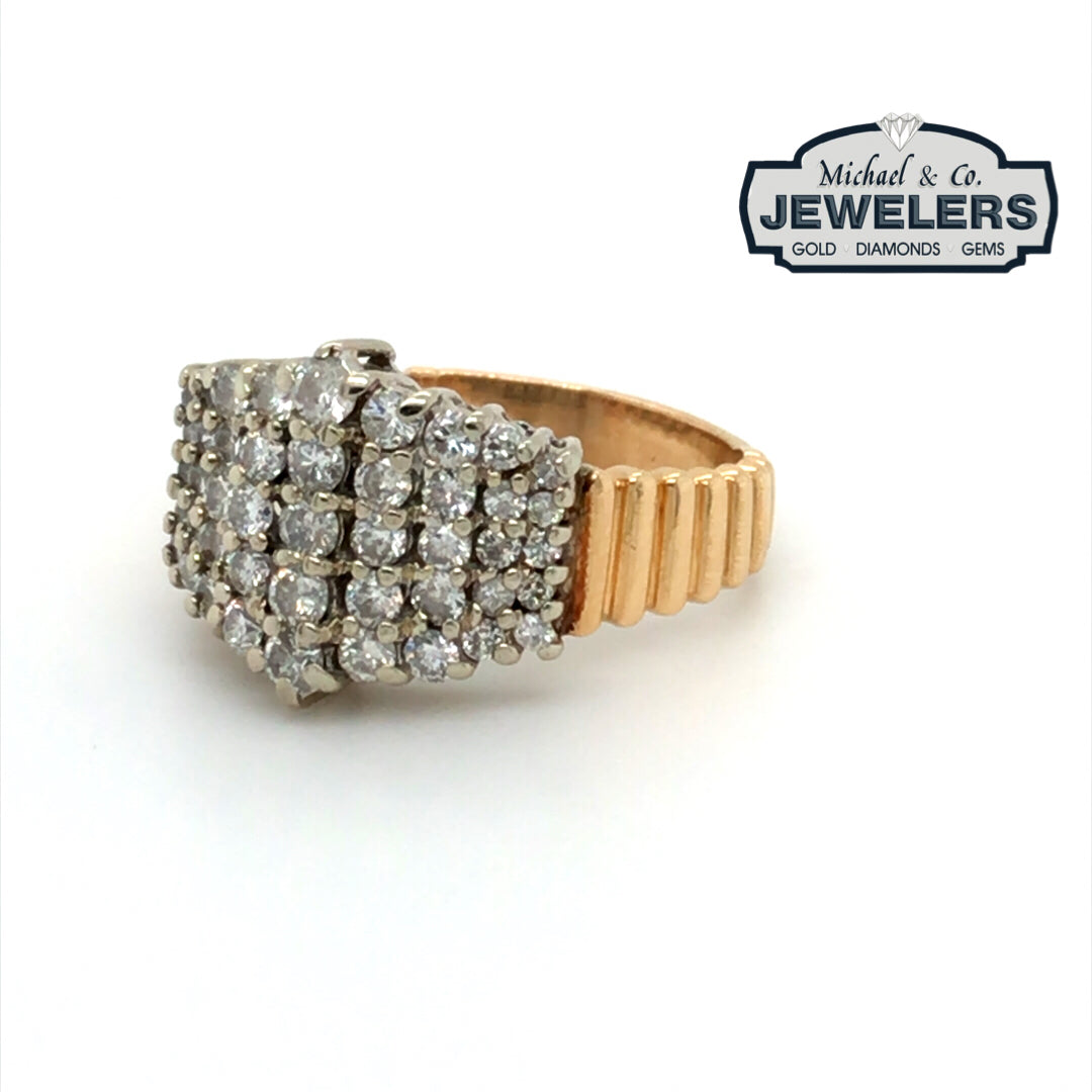 Gold ring with diamonds on a white background, branded with 'Michael & Co Jewelers'.