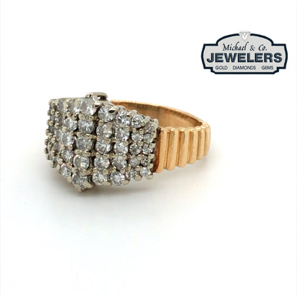 Gold ring with diamonds on a white background, branded with 'Michael & Co Jewelers'.