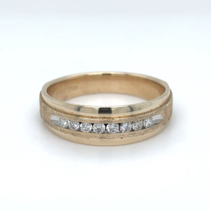Gold ring with embedded diamonds on a white background