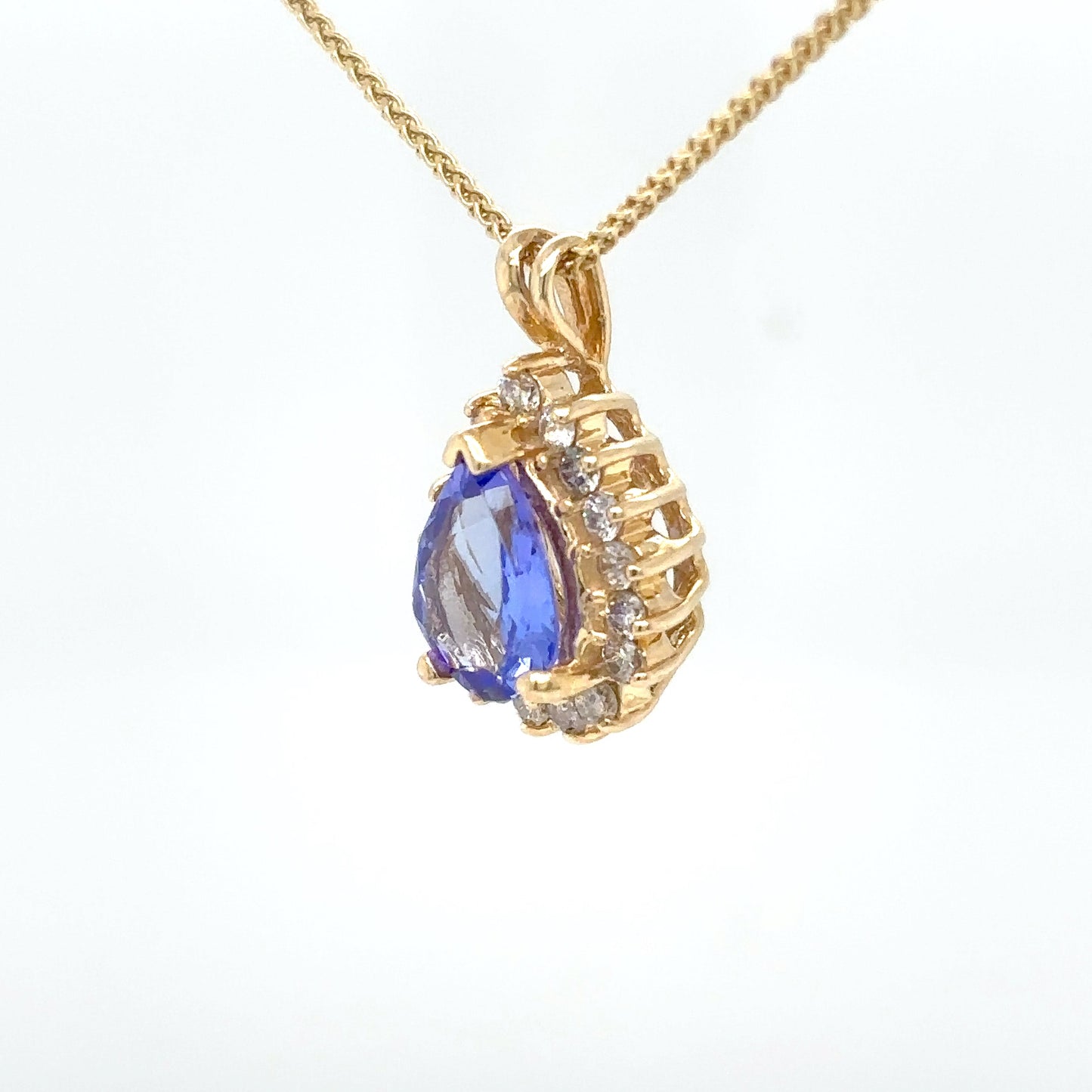 14KY 1.60CTW TANZANITE-DIAMOND HALO PENDANT "A" SI2/H 2.8G