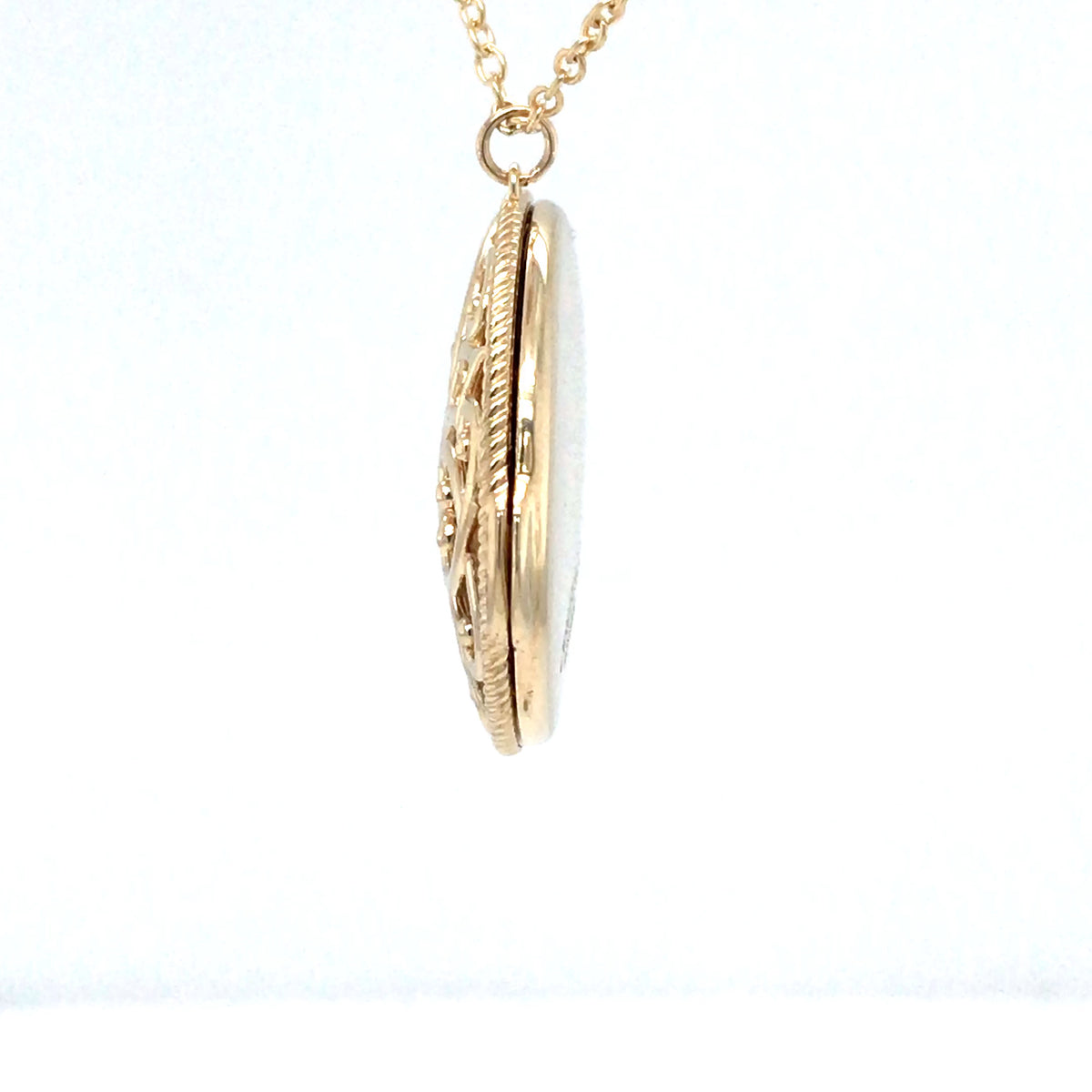 Gold locket necklace on a white background