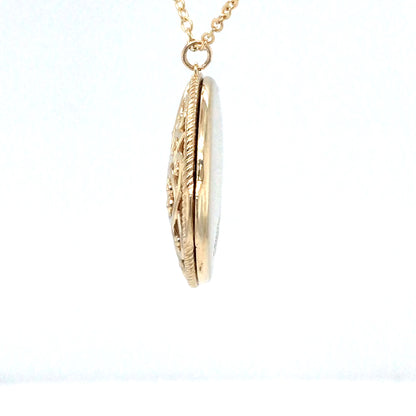 Gold locket necklace on a white background