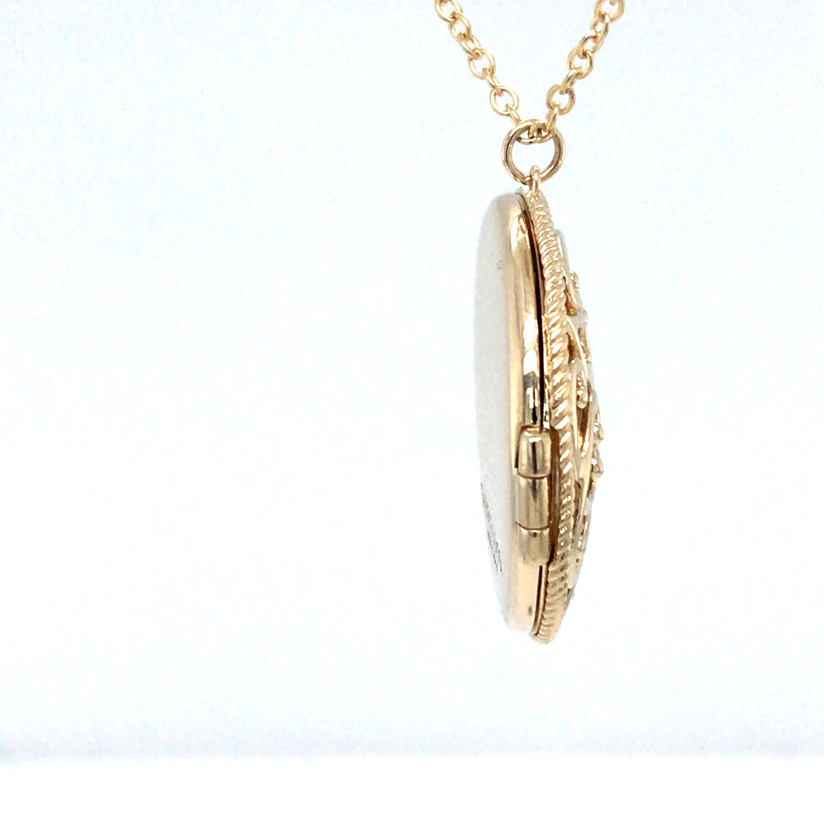 Gold necklace with a pendant on a white background