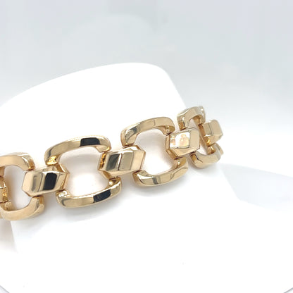 Gold chain bracelet on a white background