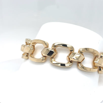 Gold chain bracelet on a white background