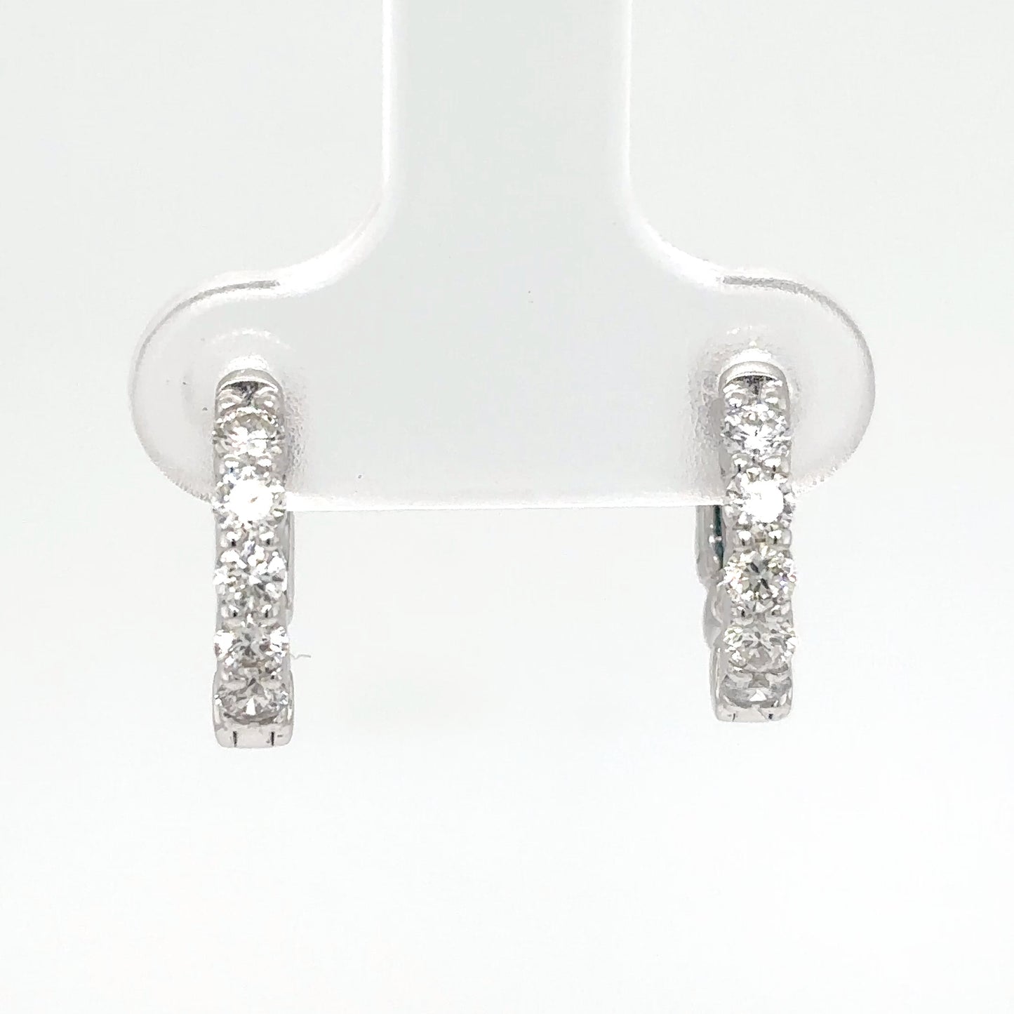 Diamond hoop earrings on a white background