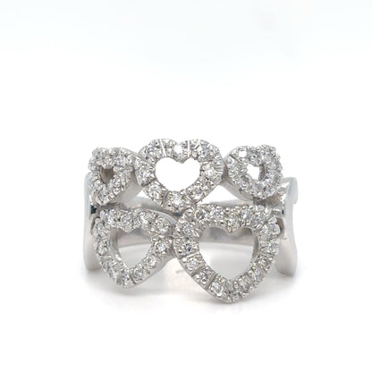 Silver ring with heart designs on a white background