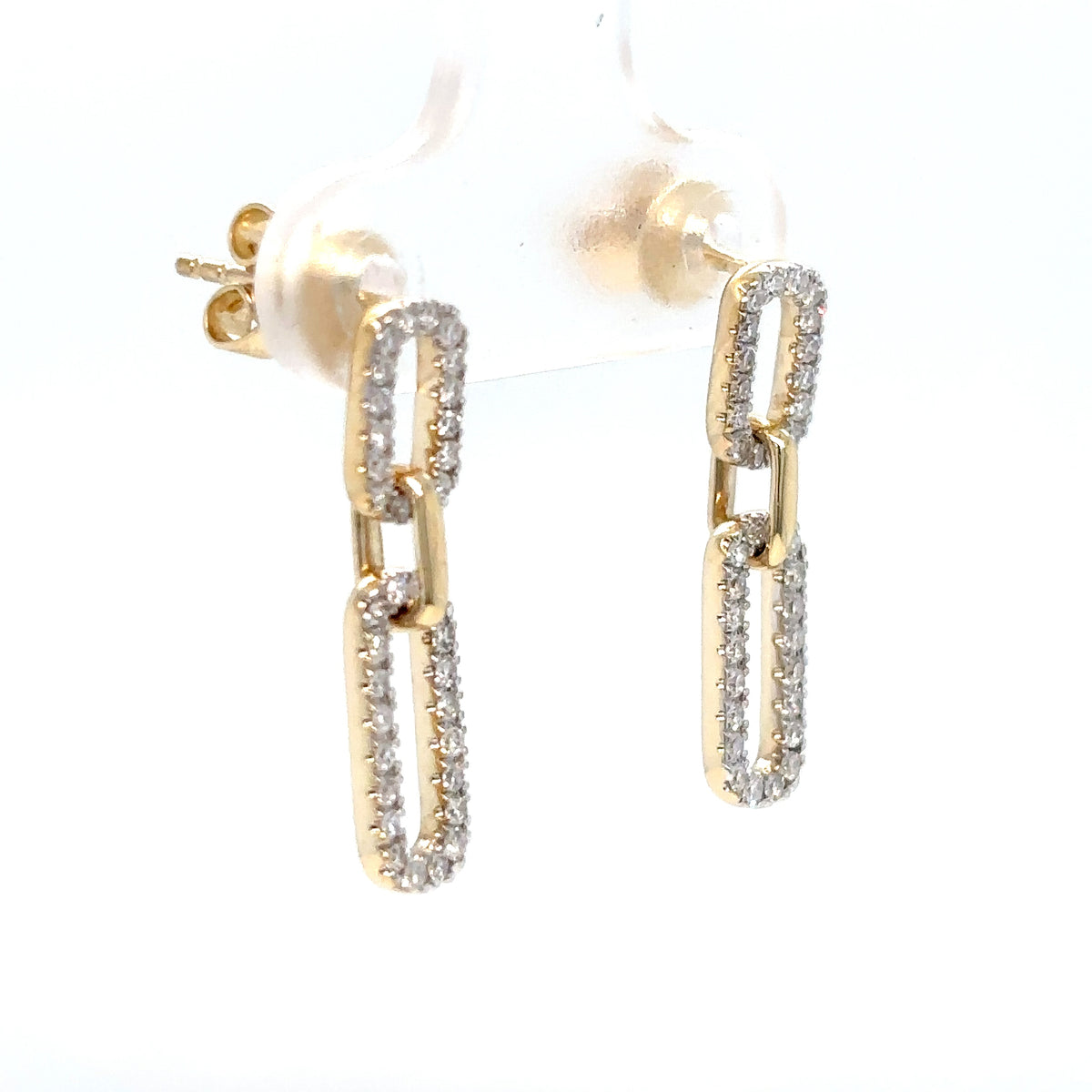 Gold hoop earrings with diamond accents on a white background
