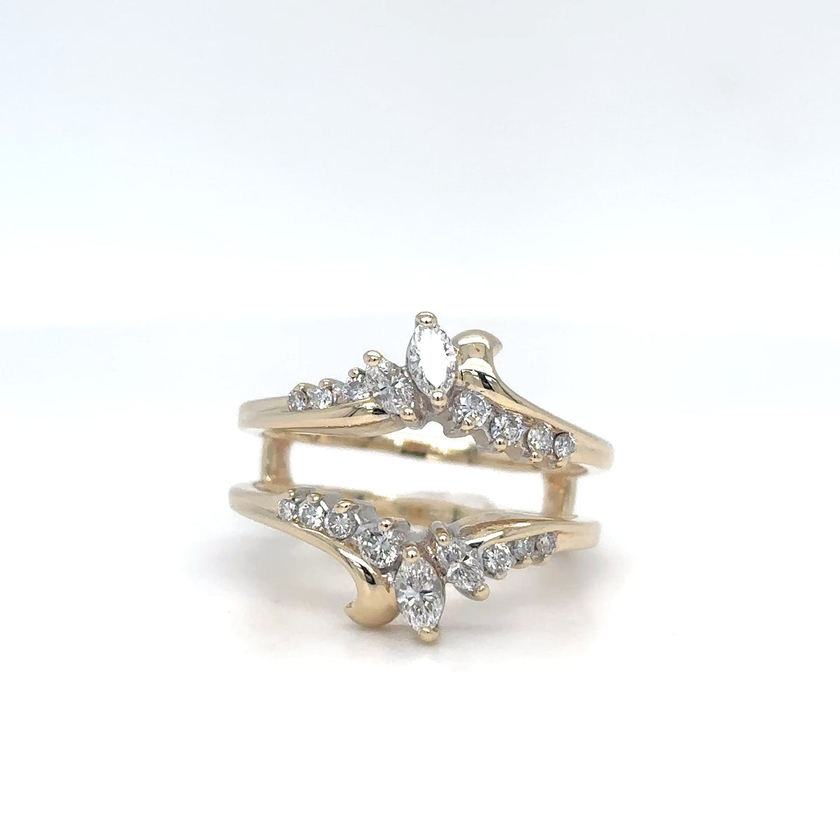 Gold ring with diamond accents on a white background