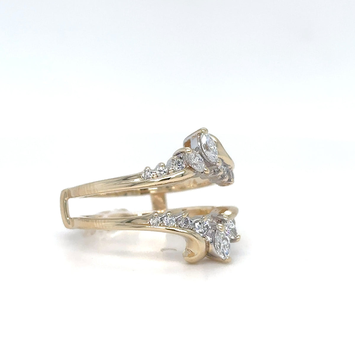 Gold ring with diamond accents on a white background