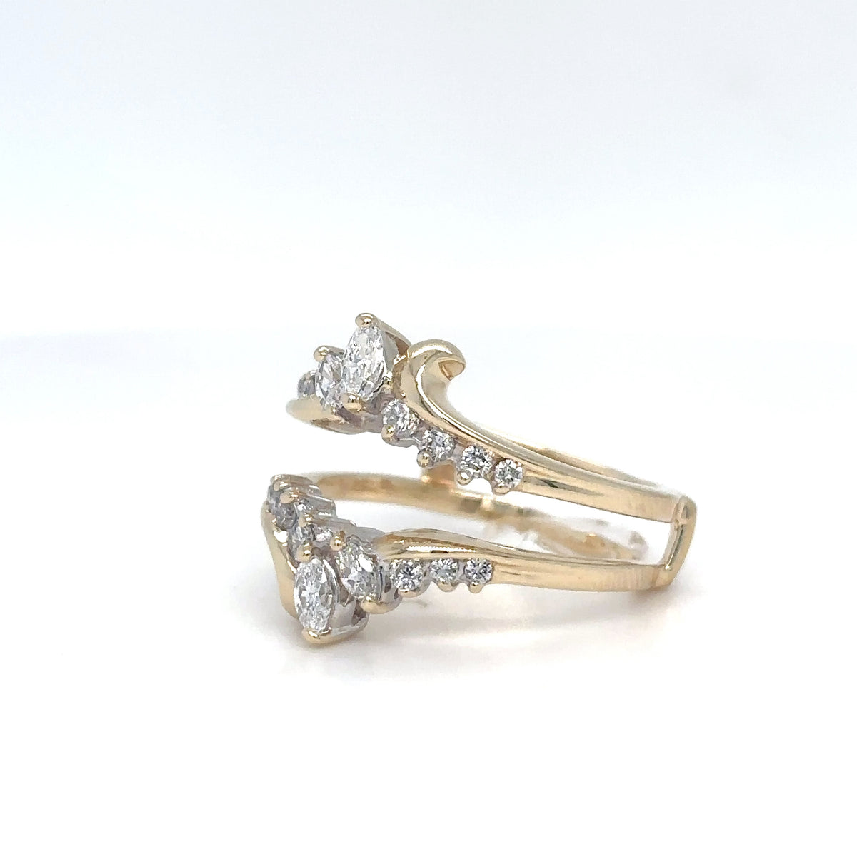 Gold ring with diamond accents on a white background