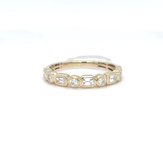 A 14K yellow gold ring featuring a row of alternating emerald-cut and round brilliant diamonds, shown on a plain white background.