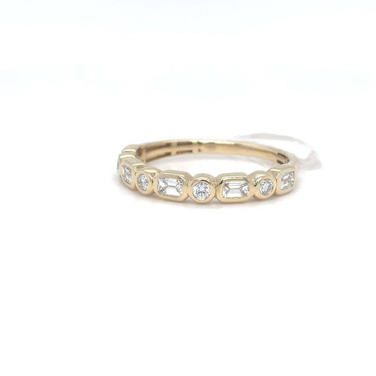 A 14K yellow gold band set with a row of emerald-cut and round brilliant diamonds, shown on a white background.