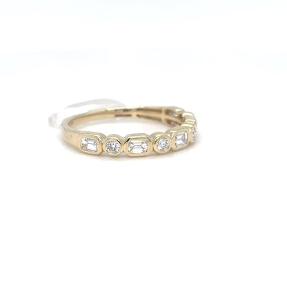 A 14K yellow gold band with alternating bezel-set emerald-cut and round brilliant diamonds, shown on a white background.