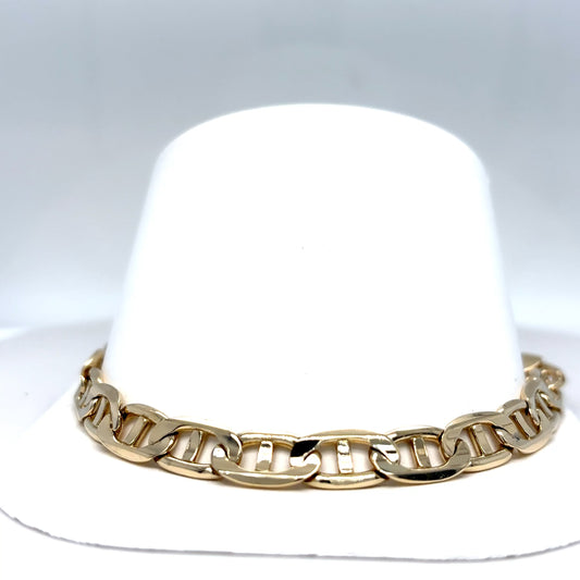 White hat with a gold chain band on a light gray background