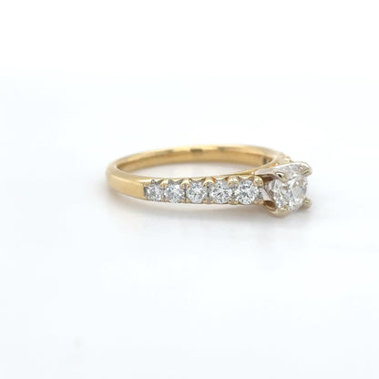 Gold ring with diamonds on a white background