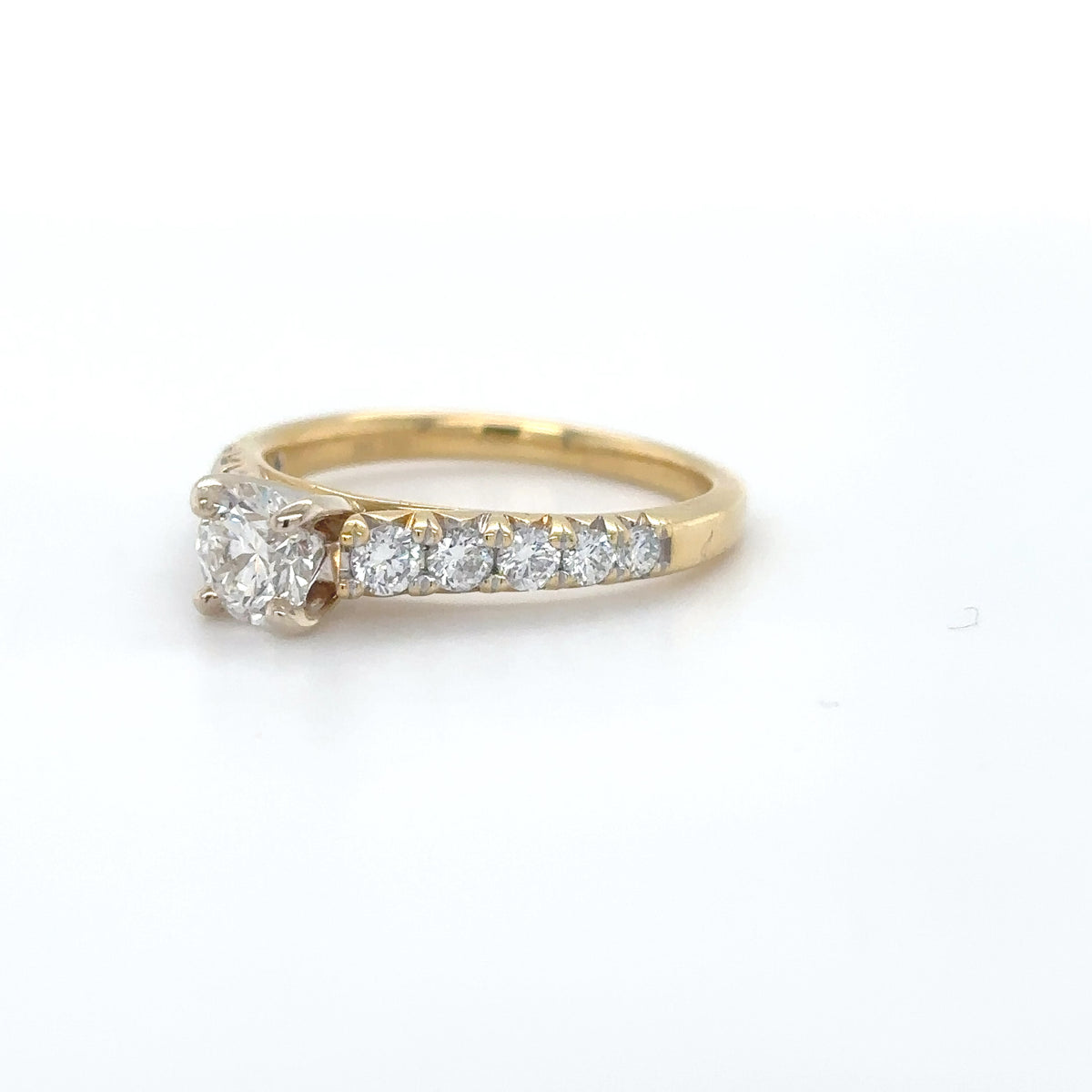 Gold ring with diamonds on a white background