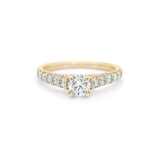 Gold ring with diamonds on a white background