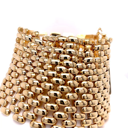 Gold beaded bracelet on a white background