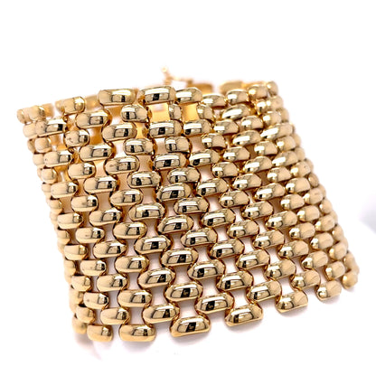 Gold beaded bracelet on a white background