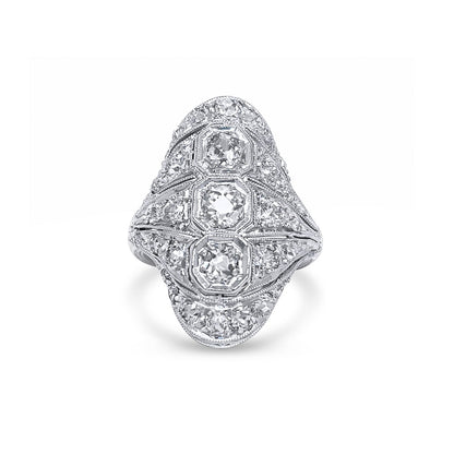 Diamond ring with intricate design on a white background